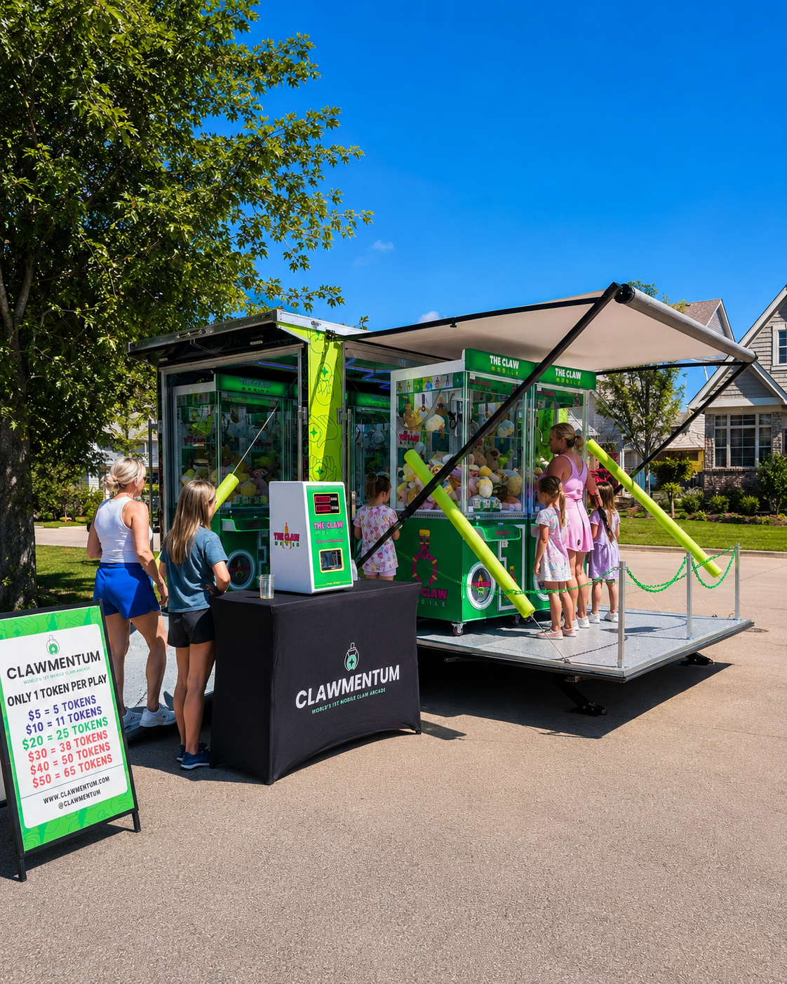 Clawmentum mobile arcade with claw machines and token station