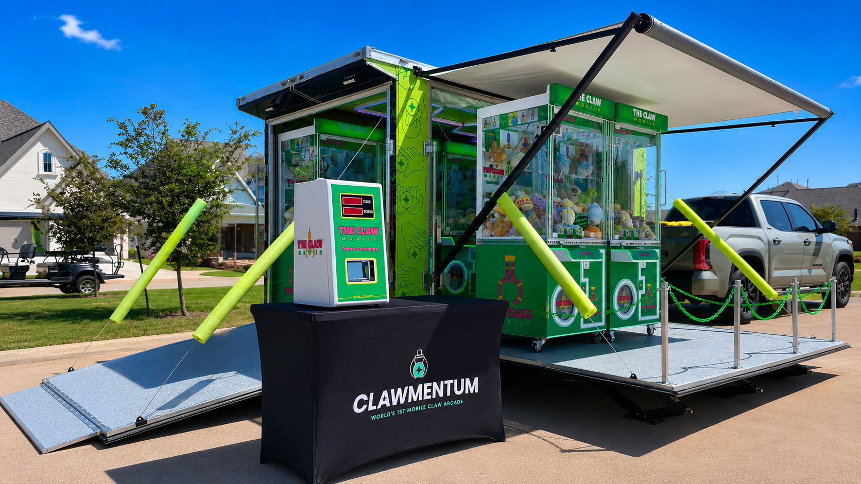 Guests playing inside the Clawmentum mobile arcade